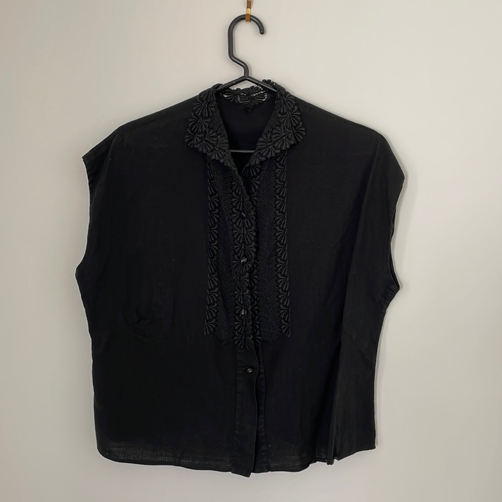 Vintage black 1950s French linen blouse with lace detail at collar and chest.